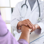 Doctor shaking hand of patient
