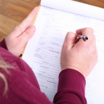Woman filling out paper form