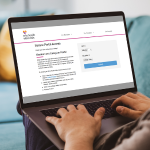 Laptop screen with image of Member Portal login screen